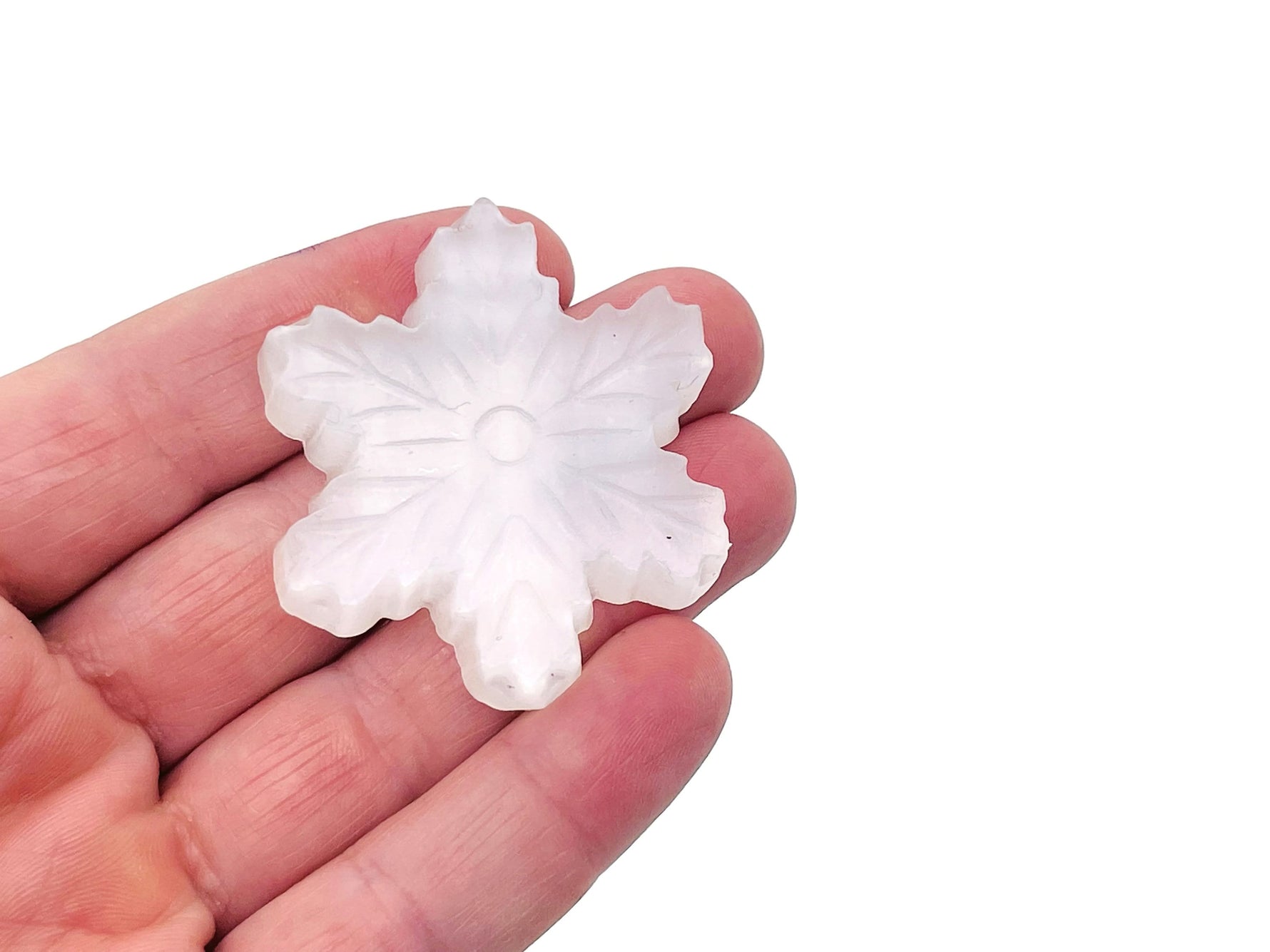 Selenite flower carving gemstone by GemstoneGO with intricate flower design and smooth polished surface.