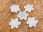 Selenite flower carving gemstone by GemstoneGO, showing intricate flower details and smooth polished surface.