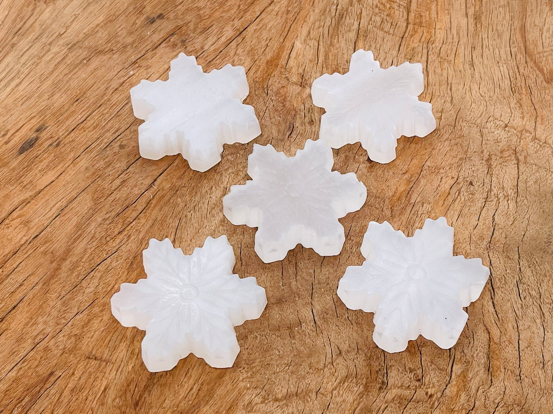 Selenite flower carving gemstone by GemstoneGO, showing intricate flower details and smooth polished surface.