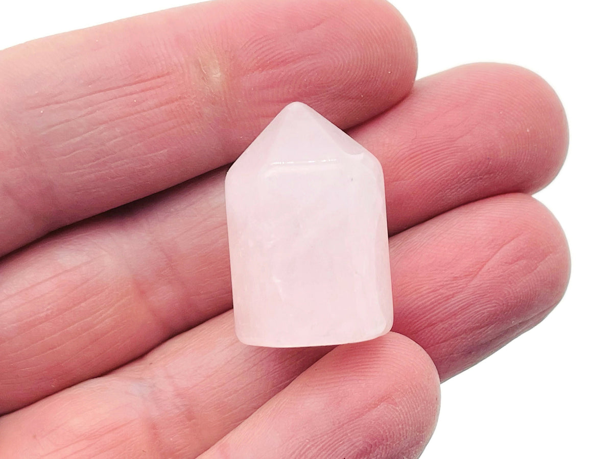 Rose Quartz gemstone, 25mm round polished stone from GemstoneGO, showcasing its soft pink color and smooth surface.
