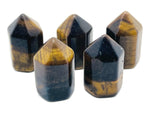 Tiger Eye obelisk tower crystal from GemstoneGO, 25mm gemstone with rich golden-brown bands and smooth polished surface.