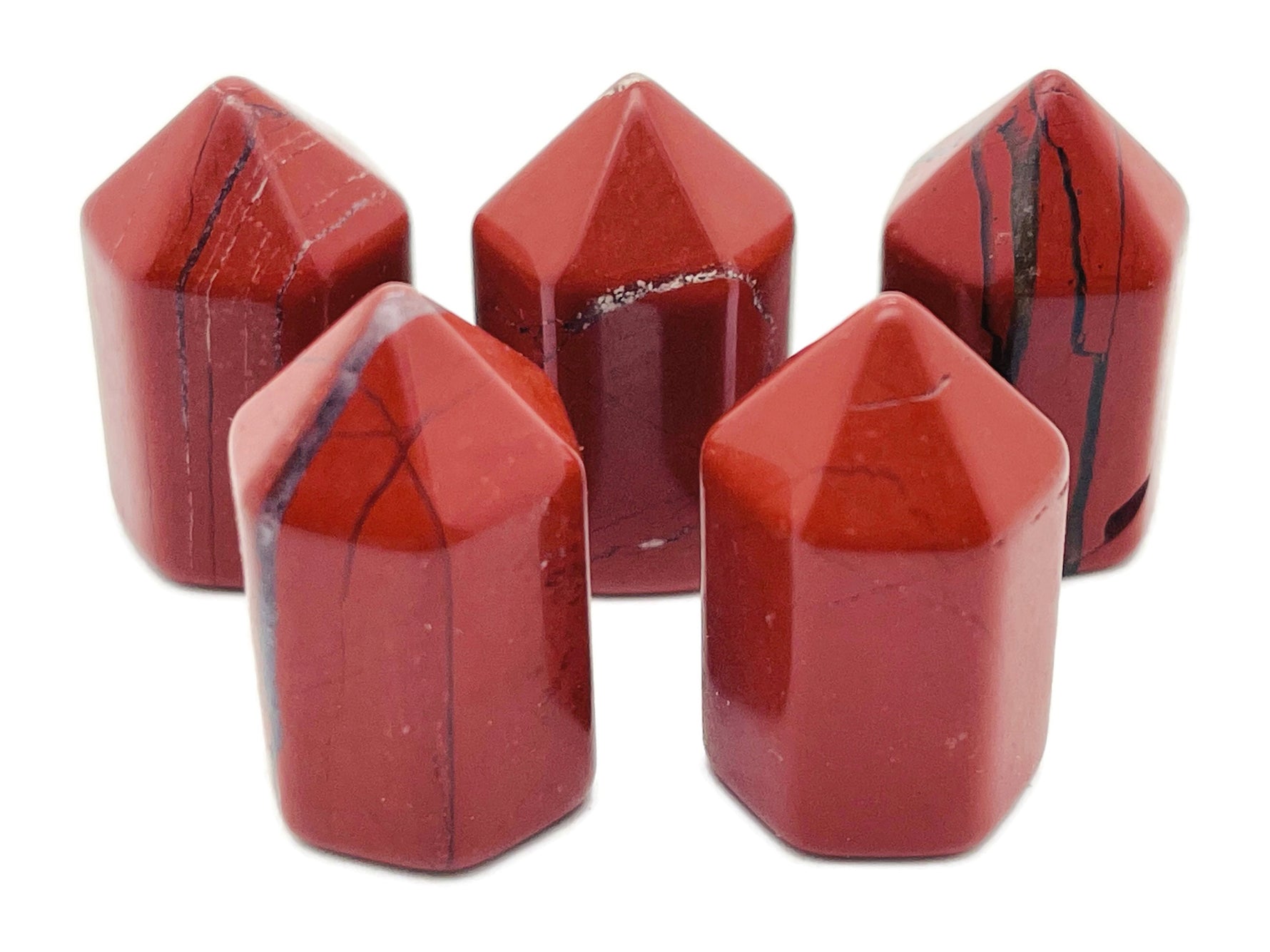Red Jasper obelisk tower crystal, 25mm, from GemstoneGO, showcasing a polished red gemstone with natural striations and smooth surface.