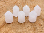 Clear Quartz obelisk tower crystal from GemstoneGO, 25mm, showcasing a polished, transparent gemstone with natural clarity and facets.