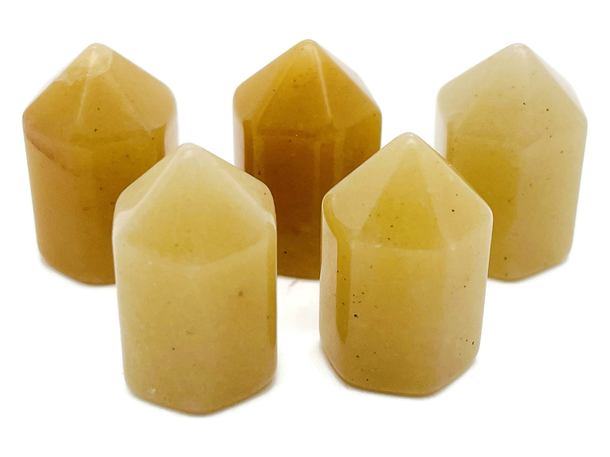 Yellow aventurine obelisk tower crystal, 25mm, from GemstoneGO, showcasing a polished yellow gemstone with natural veining.