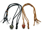 Handmade macrame crystal holder necklace by GemstoneGO with empty pouch, featuring intricate knot details and natural gemstone accents.