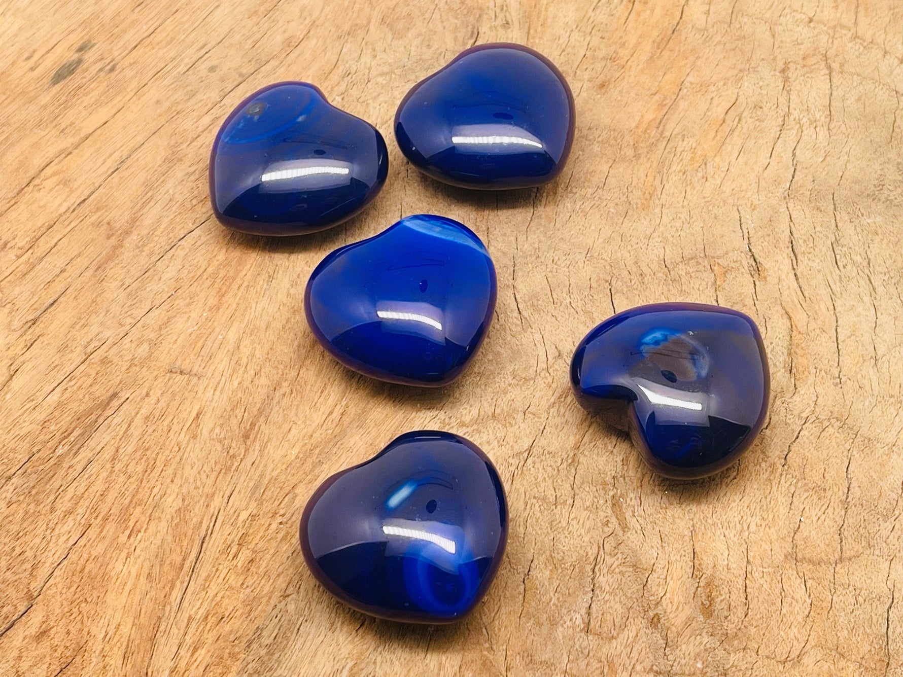 Blue agate heart gemstone, 40mm by GemstoneGO, showing a polished blue agate heart with natural banding and vibrant coloration.