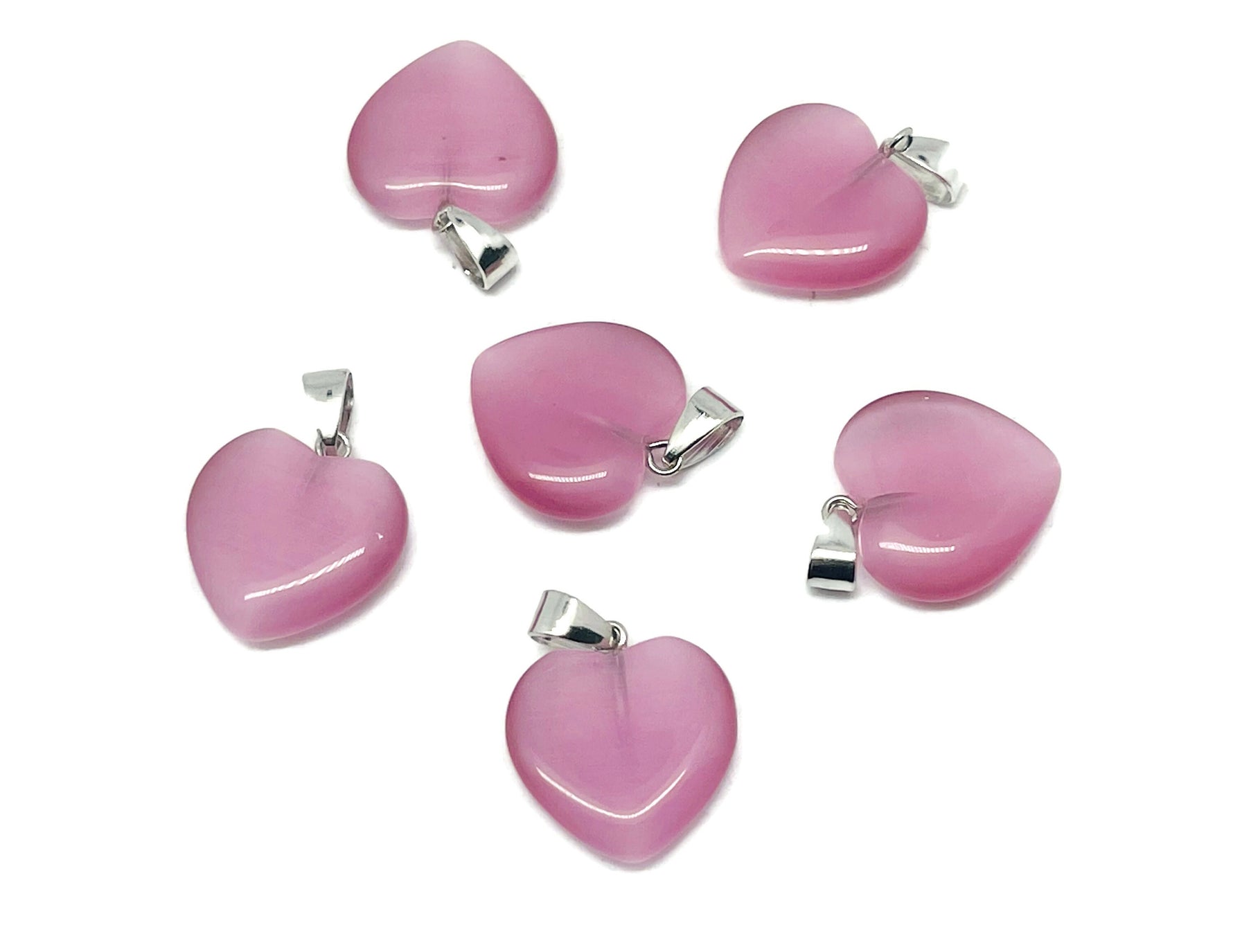 Pink cats eye heart pendant with crystals from GemstoneGO, showcasing a mini healing gemstone jewelry piece.