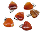 Carnelian heart pendant by GemstoneGO featuring a mini crystal design, perfect for healing and gifting.