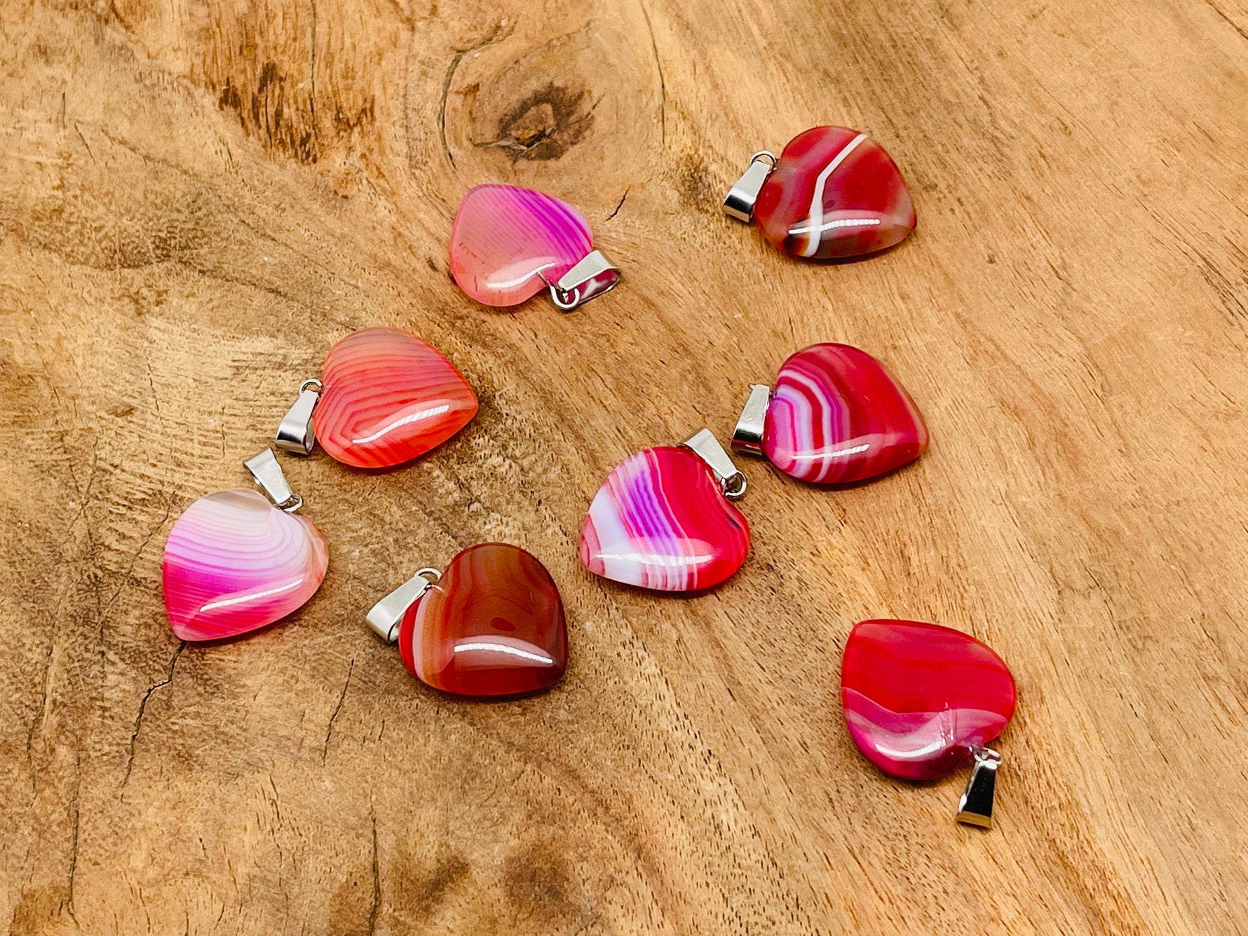 Pink agate heart pendant from GemstoneGO featuring a mini crystal design, perfect for healing and gift-giving.
