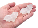 Selenite gemstone carving of a bad symbol, showcasing smooth, translucent white stone with detailed craftsmanship from GemstoneGO.