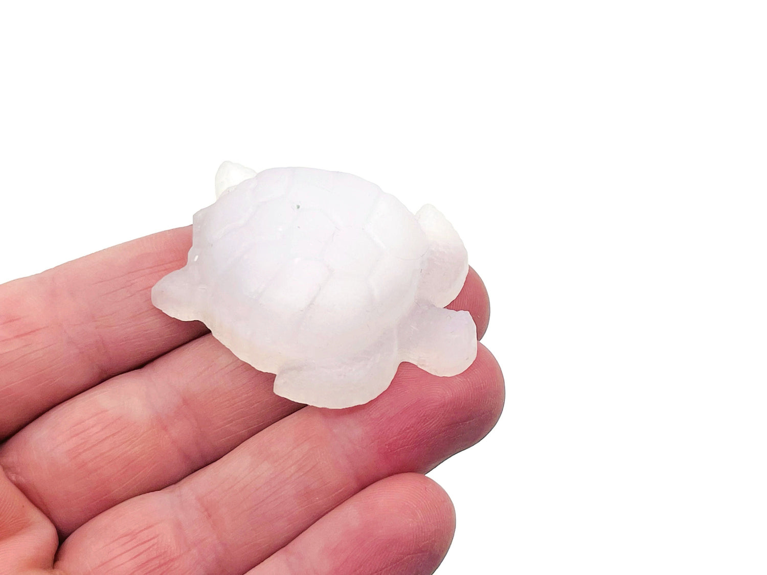 Selenite turtle carving gemstone from GemstoneGO, showing a smooth, detailed turtle shape with a soft, translucent white appearance.