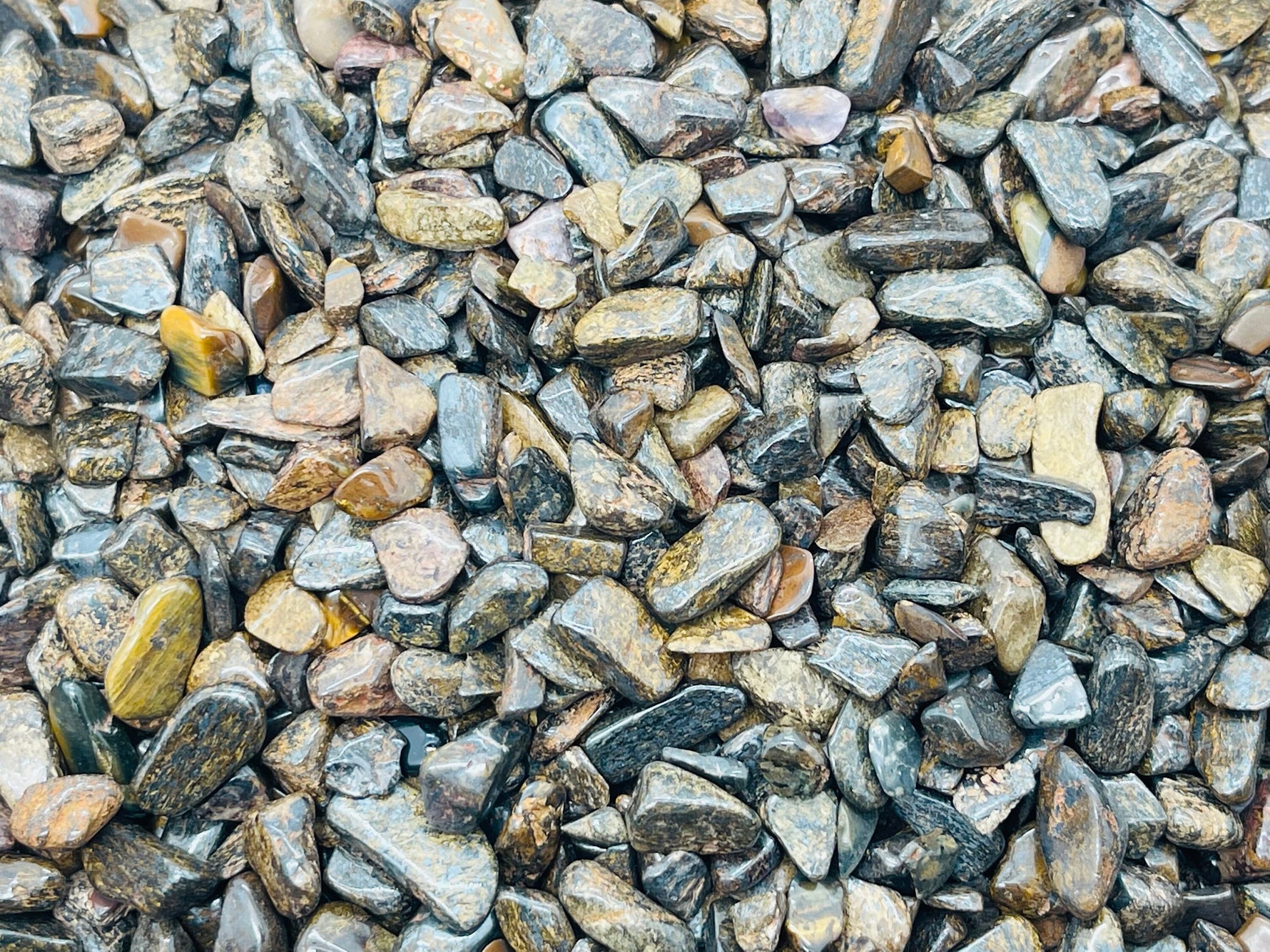 Semi-tumbled bronzite crystal chips in 5-7mm size, bulk gemstone stones from GemstoneGO for jewelry or craft projects.