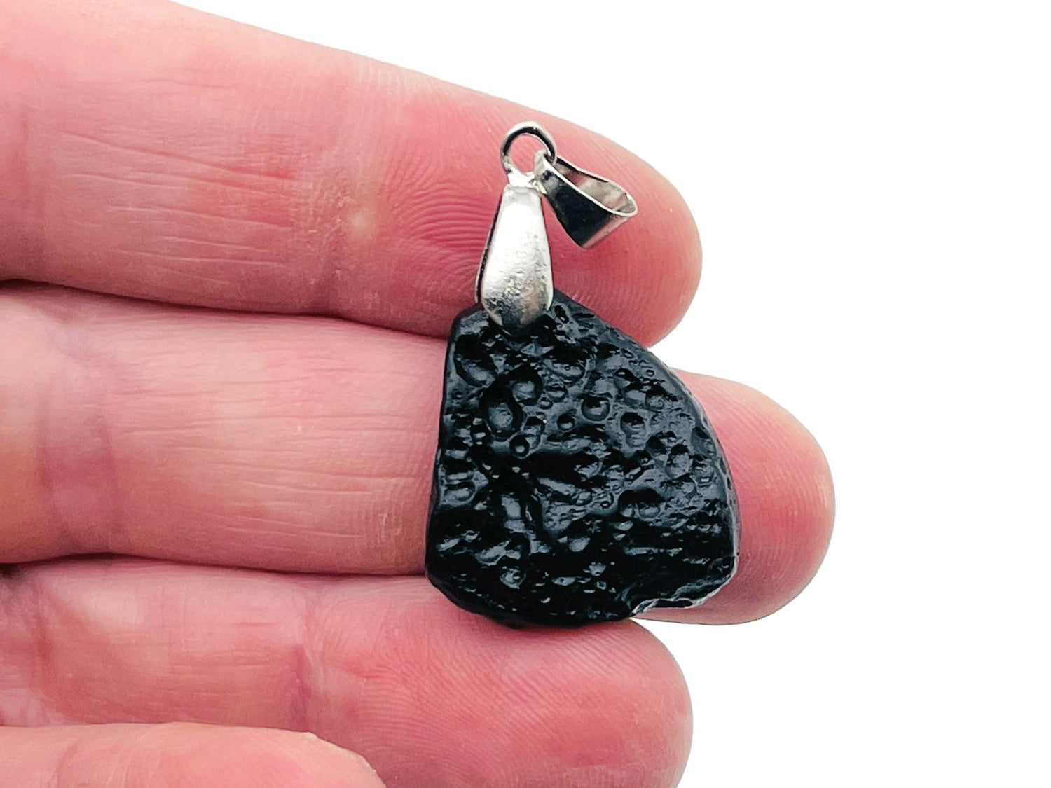 Tektite pendant with Tibetan tektike meteorite gemstone, handcrafted jewelry piece featuring natural stone and intricate design.