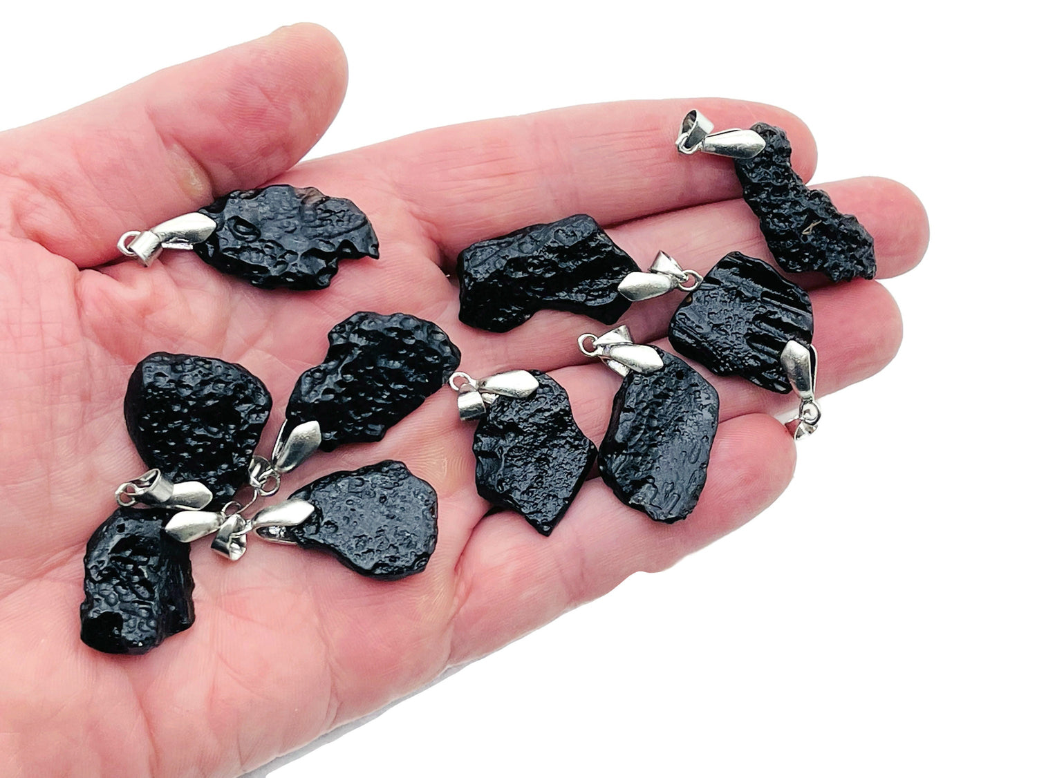 Tektite pendant featuring Tibetan Tektike meteorite gemstone, showcasing a unique natural stone on a jewelry pendant.