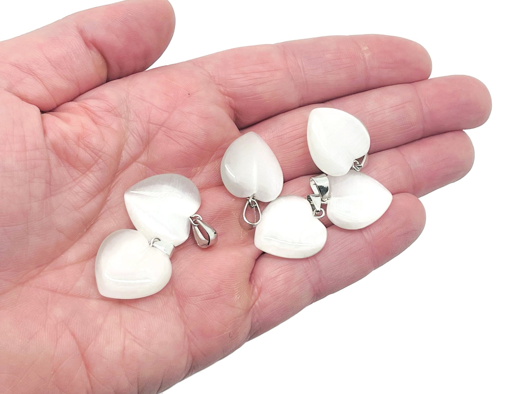 White cats eye heart pendant with crystals from GemstoneGO, featuring a mini healing gemstone jewelry design.