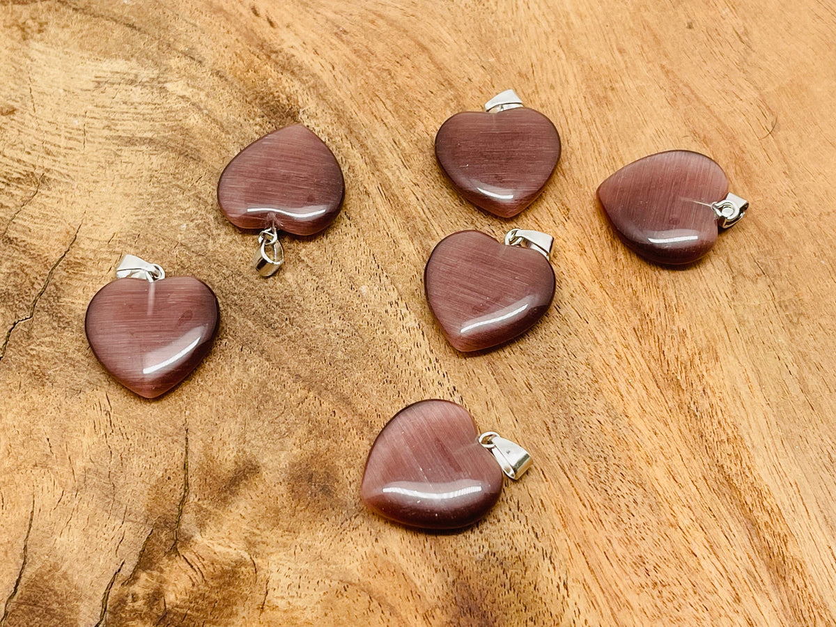 Brown cats eye heart pendant with crystal accents from GemstoneGO, showcasing a mini healing gemstone jewelry piece.