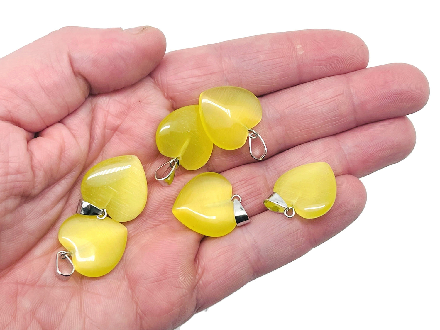 Yellow cat’s eye heart pendant with crystals, gemstone jewelry for healing, featuring a mini crystal design from GemstoneGO.
