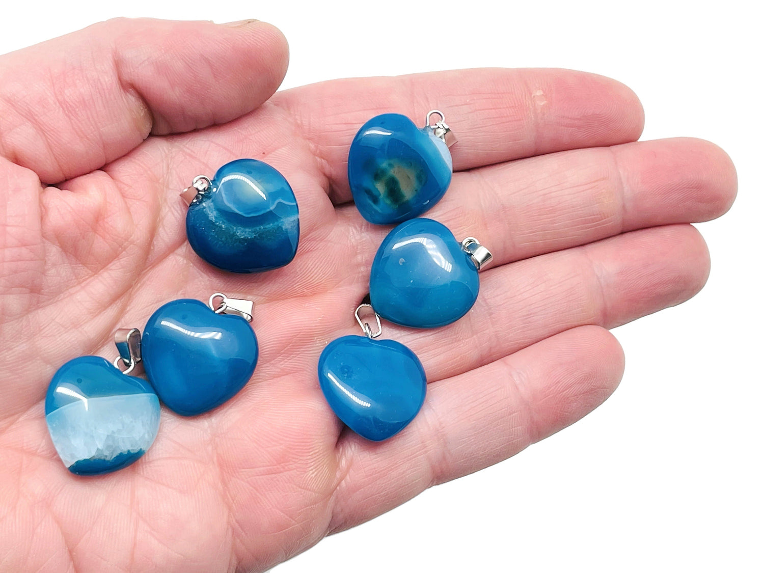 Blue Agate Heart Pendant by GemstoneGO, mini crystal healing jewelry showcasing a polished blue agate heart with silver setting.
