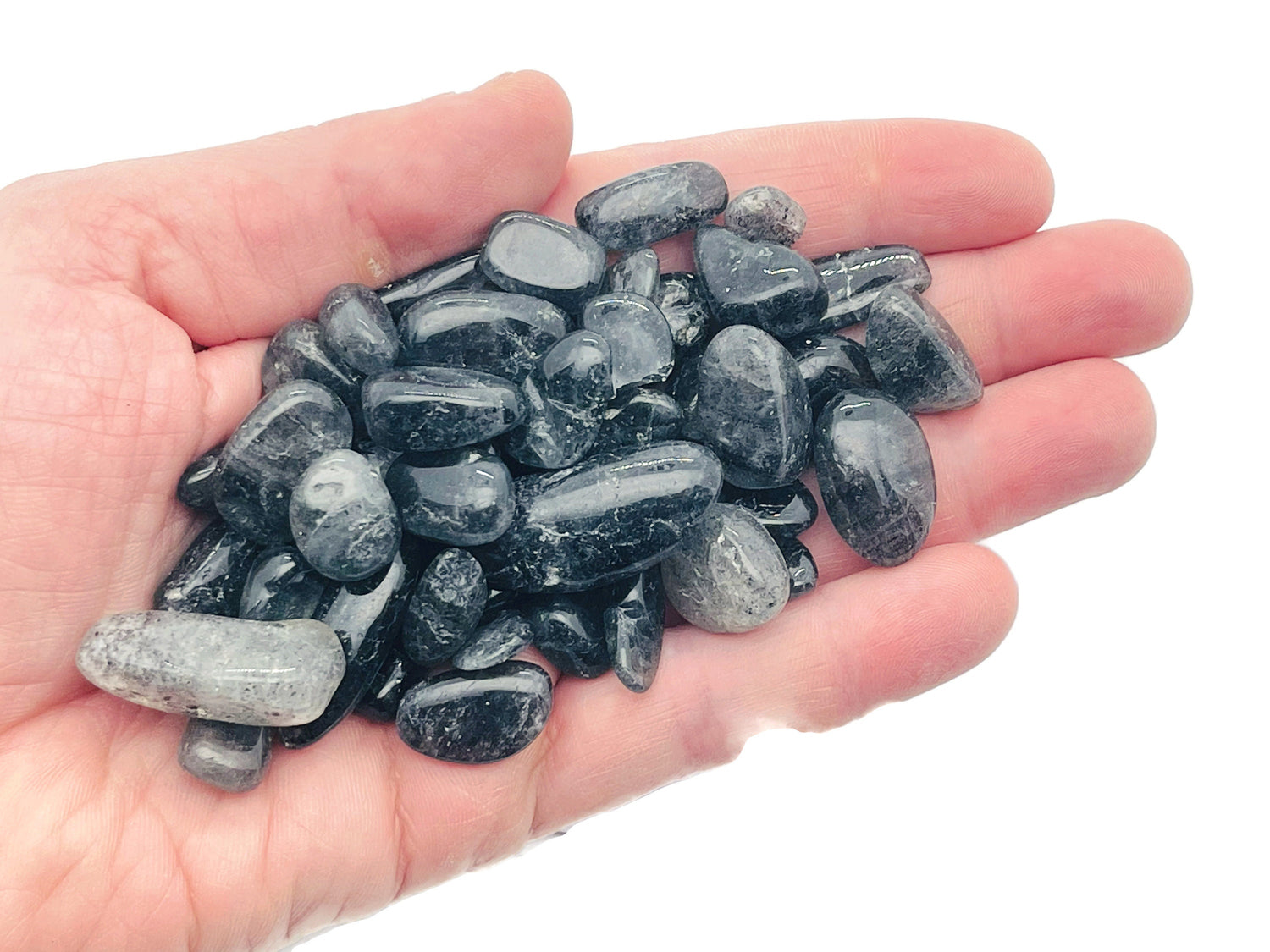 Black strawberry quartz crystal chips, semi-tumbled gemstone stones in 7-18mm, shown in bulk with a natural, textured appearance.