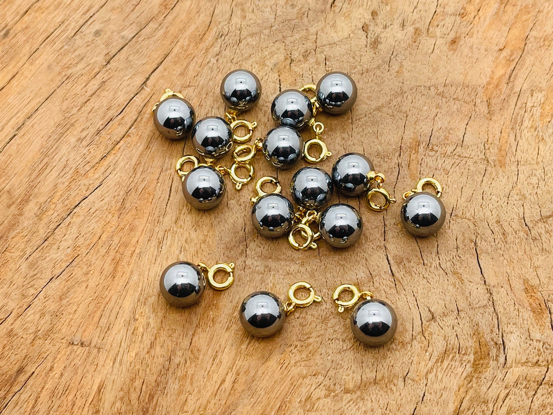 Terahertz ball gemstone pendant from GemstoneGO, featuring a polished round gemstone for jewelry making displays.