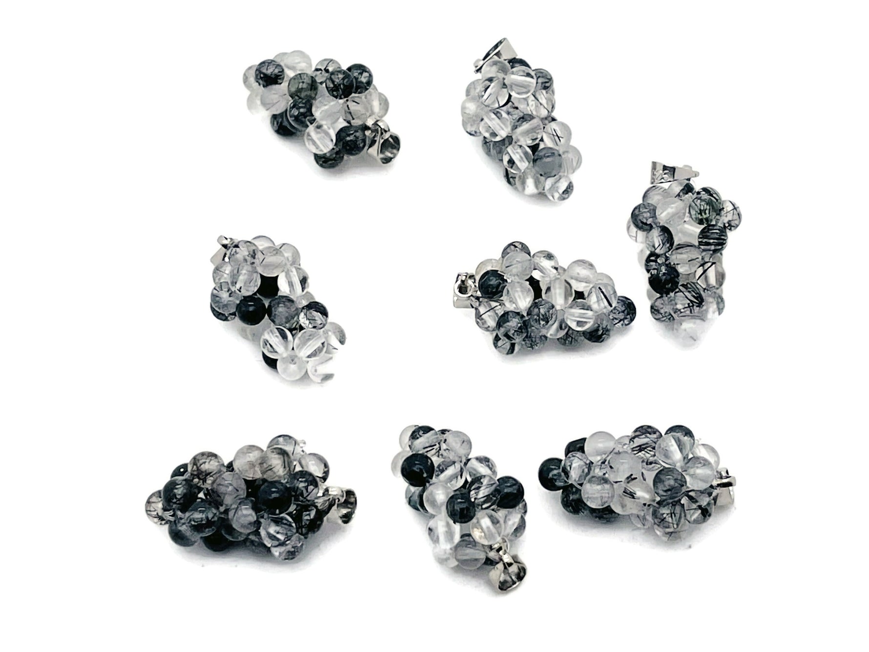 Tourmalinated Quartz Grape Crystal Pendant by GemstoneGO, featuring a detailed crystal grape design with black tourmaline inclusions.