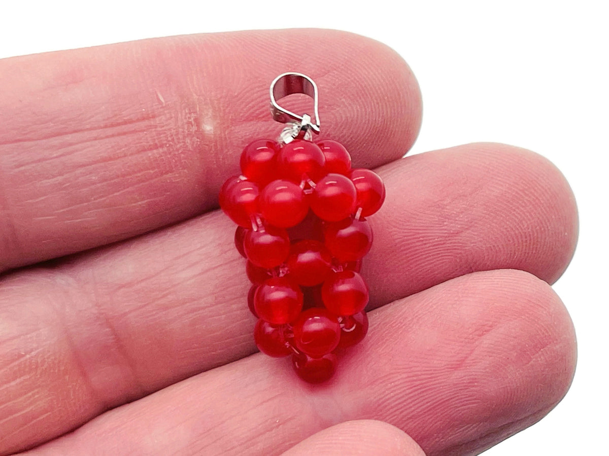 Carnelian grape crystal pendant by GemstoneGO featuring a crystal grape design, perfect for unique crystal gifts.