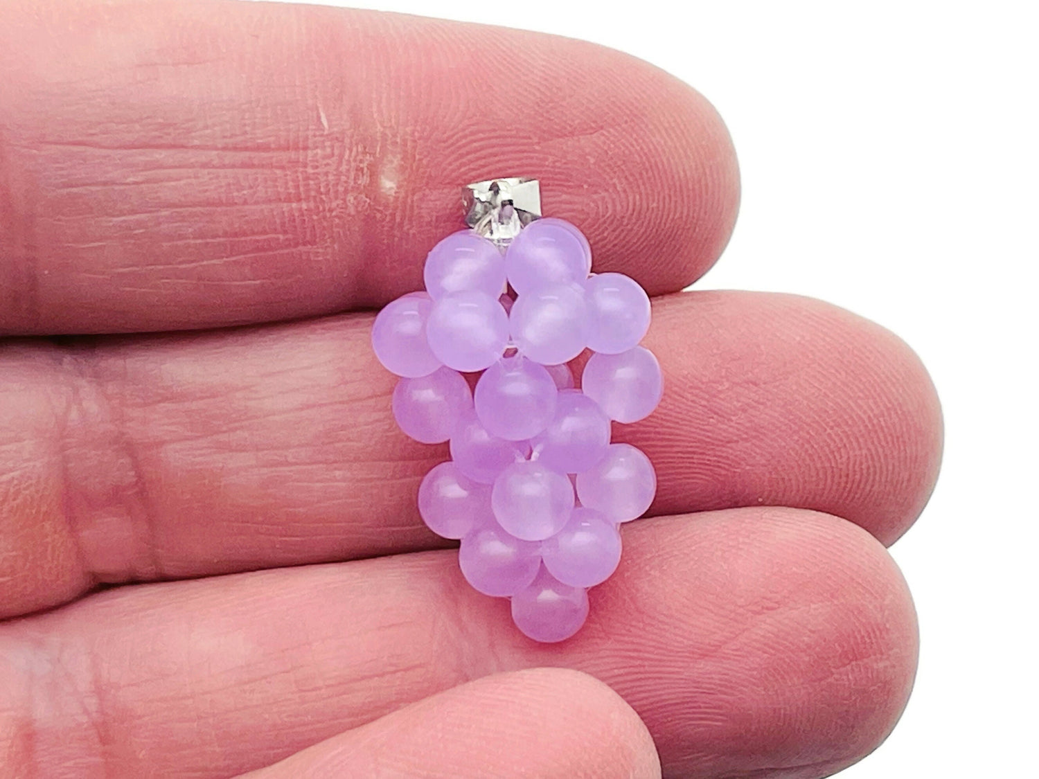 Purple agate grape crystal pendant from GemstoneGO featuring a detailed crystal grape design on a silver chain.