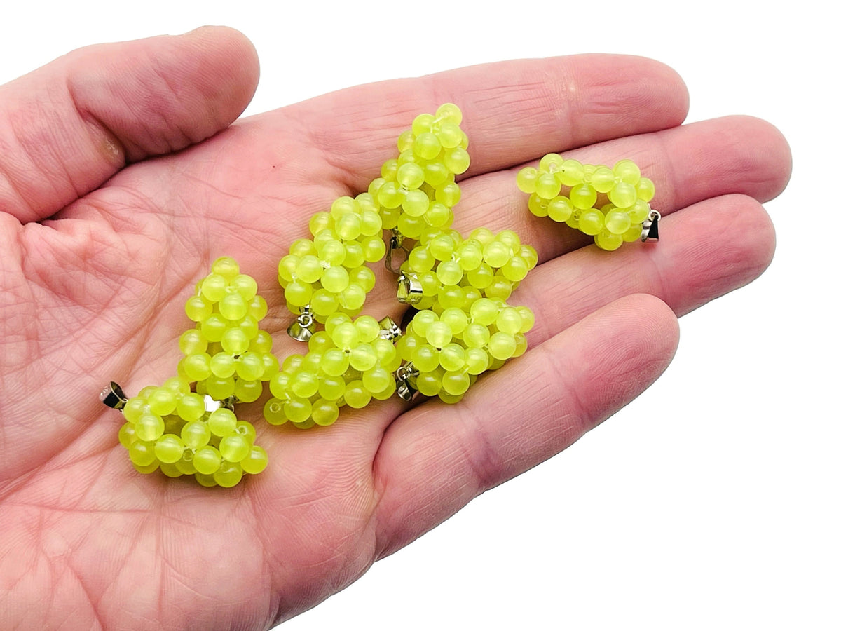 Green agate grape crystal pendant with gemstone detailing, showcasing a vibrant green stone shaped like a cluster of grapes.