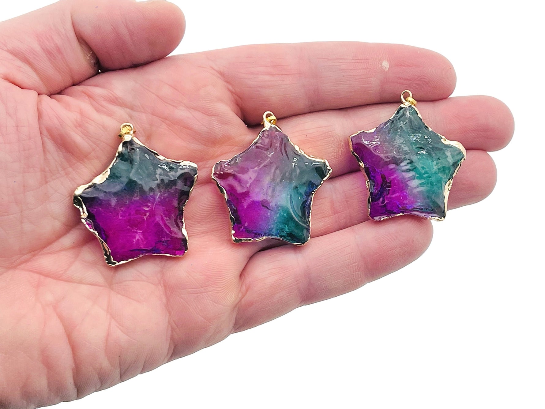 Purple and green rainbow aura star crystal pendant featuring a loose quartz gemstone by GemstoneGO.