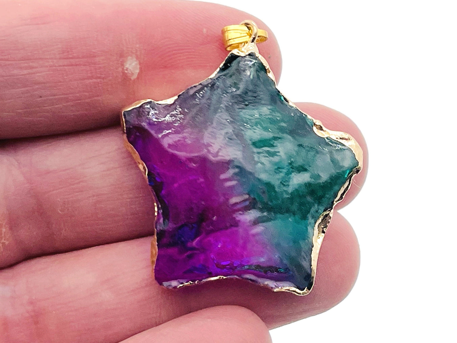 Purple and green quartz Rainbow Aura star crystal pendant, loose gemstone from GemstoneGO, showcasing vibrant colors and intricate star shape.
