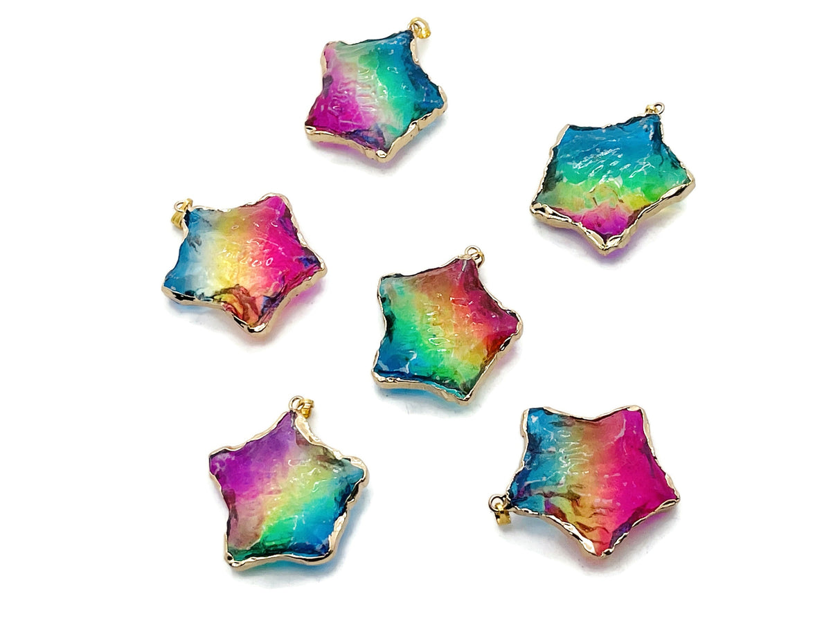 Pink, yellow, and blue rainbow aura star crystal pendant from GemstoneGO, showcasing a loose colorful gemstone with a star shape.