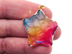 Pink, yellow, and blue rainbow aura star crystal pendant from GemstoneGO featuring a loose crystal with vibrant, iridescent colors.
