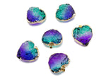 Green and purple Rainbow Aura Heart Crystal Pendant from GemstoneGO, showcasing a vibrant, loose crystal with iridescent rainbow hues.