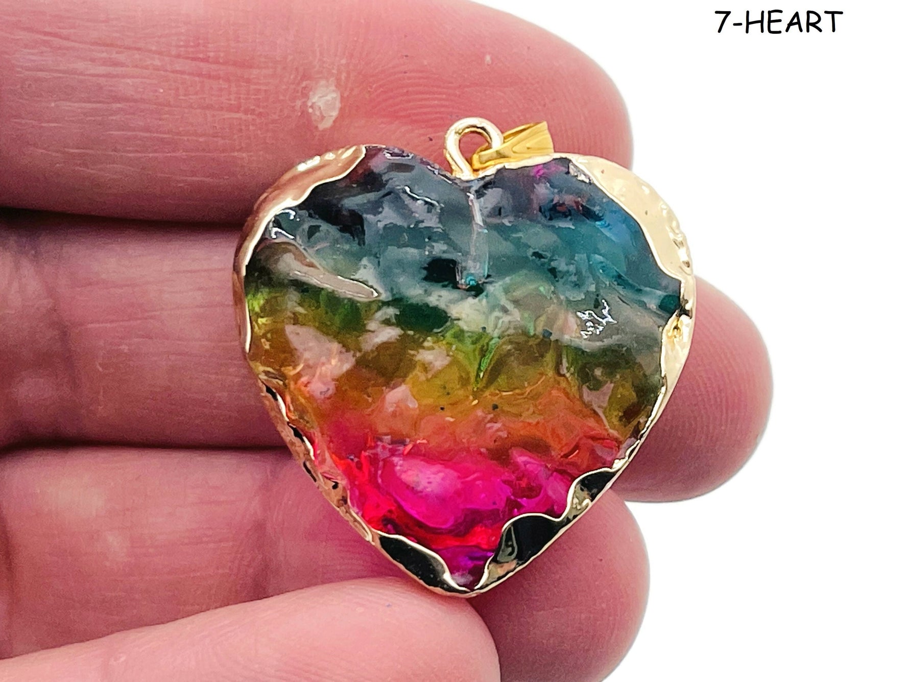 Rainbow Aura Heart Crystal Pendant from GemstoneGO featuring a moon-star-heart design and a loose, colorful crystal for jewelry making