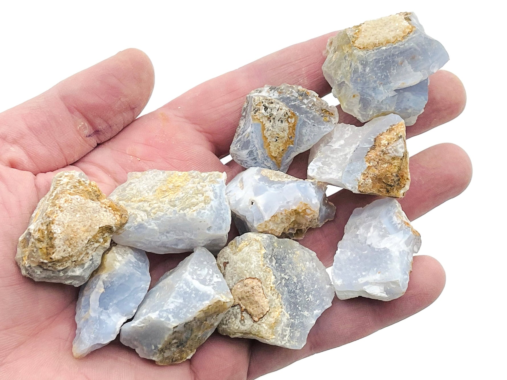 Raw Blue Lace Agate gemstone from GemstoneGO, showcasing its soft blue color and intricate lace-like patterns.
