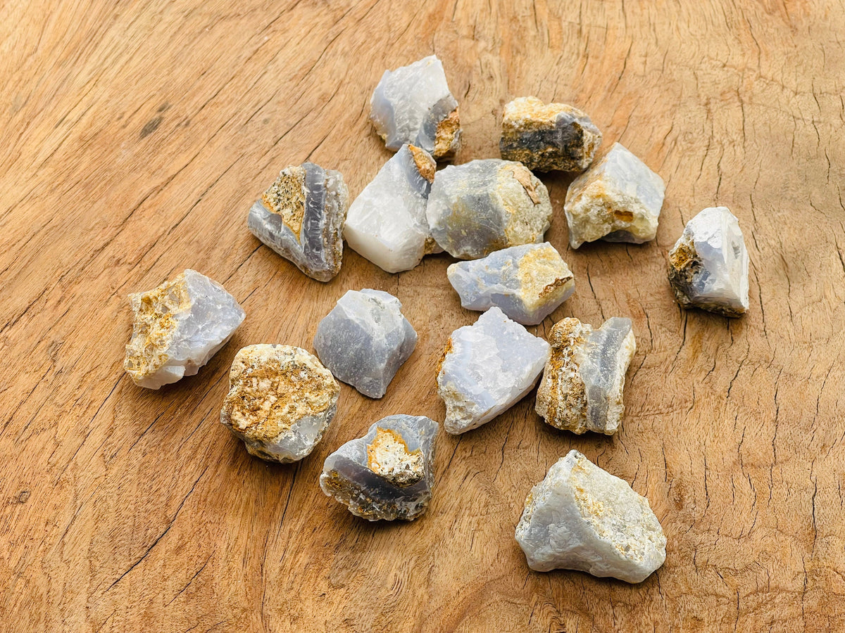Raw Blue Lace Agate gemstone from GemstoneGO, showcasing its light blue and white banded patterns in natural form.