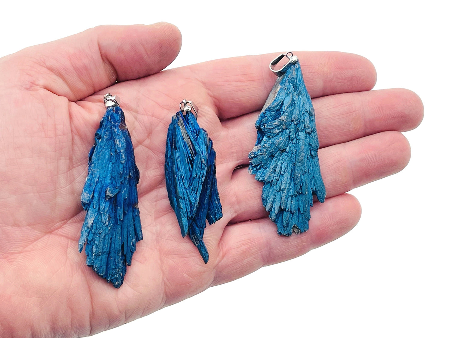 Blue Kyanite fan crystal pendant from GemstoneGO, showcasing a vibrant blue gemstone with a fan-shaped design and silver bail.