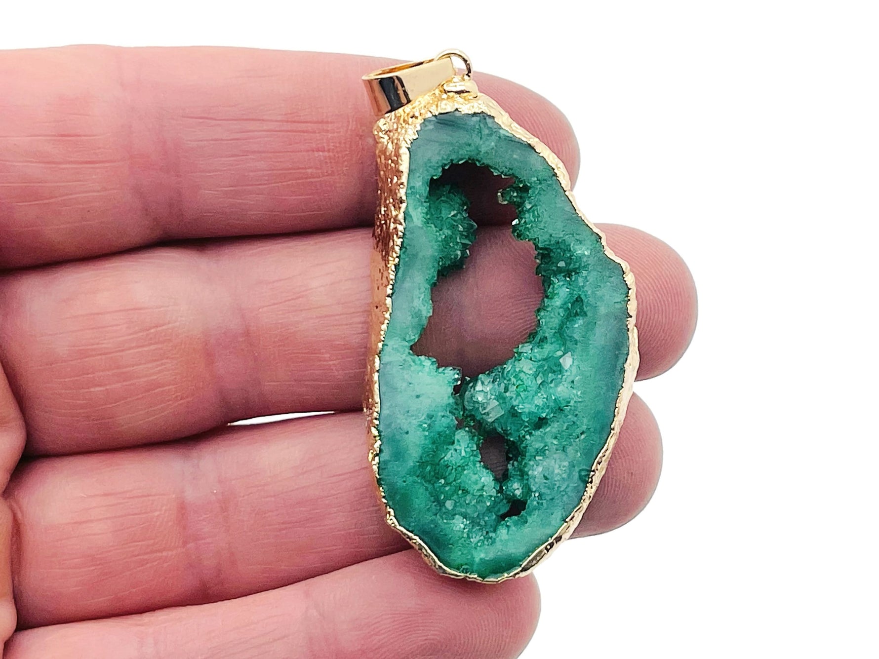 Green agate geode druzy slice pendant with natural crystalline interior, crafted by GemstoneGO.