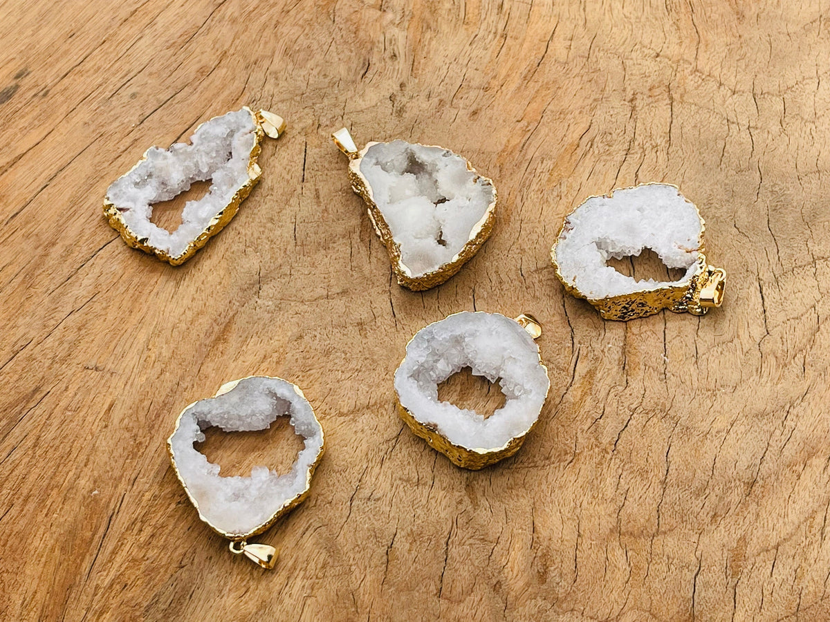 White agate geode druzy slice pendant from GemstoneGO, showcasing a sparkling crystal-filled geode with a smooth white agate exterior.