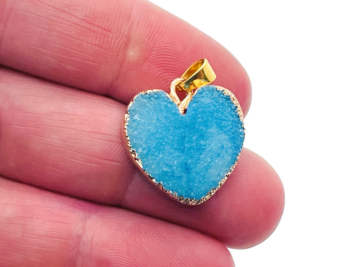 Blue agate heart geode pendant featuring druzy crystal slice, gemstone jewelry with natural blue and white agate details.