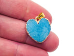 Blue agate heart geode pendant featuring druzy crystal slice, gemstone jewelry with natural blue and white agate details.