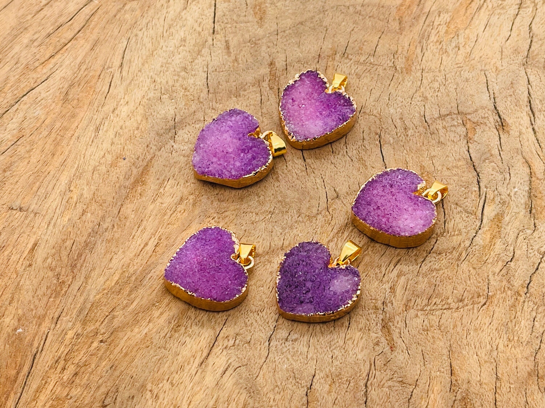 Purple agate heart geode pendant with druzy crystal details, featuring a natural gemstone design from GemstoneGO.