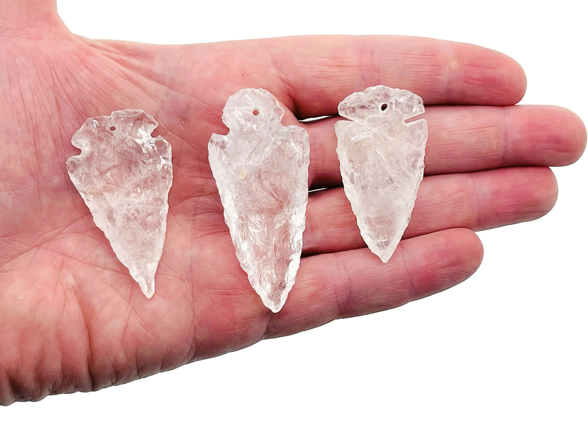 Clear quartz arrow point pendant from GemstoneGO, drilled crystal jewelry with a polished, pointed crystal design.