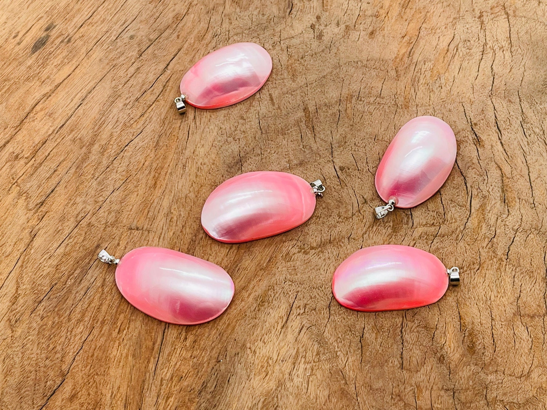 Pink natural pearl pendant from GemstoneGO, showcasing a delicate pearl with silver setting, ideal for jewelry making projects.
