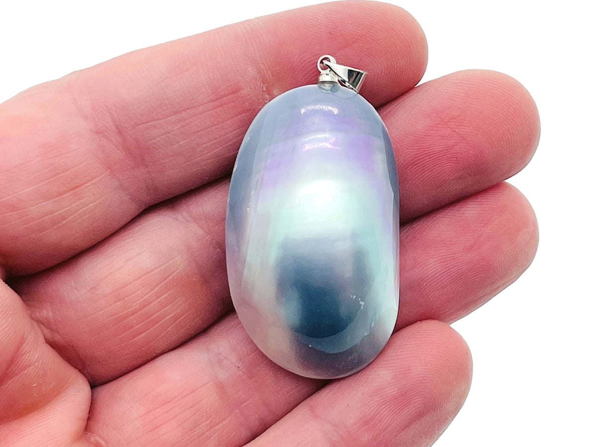 Blue natural pearl pendant from GemstoneGO with a delicate silver setting, perfect for jewelry making and bulk crystal collections.