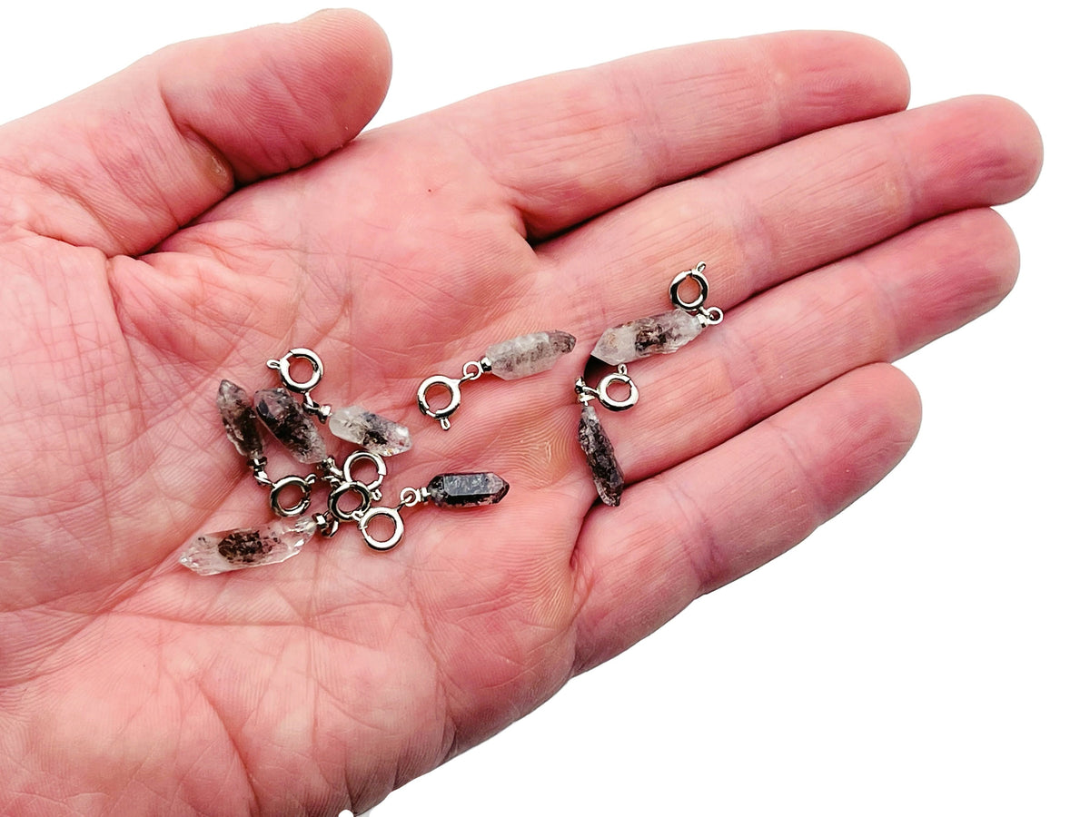 Herkimer Diamond crystal pendant featuring a sparkling gemstone with silver setting, ideal for making jewelry or as a birthstone pendant.