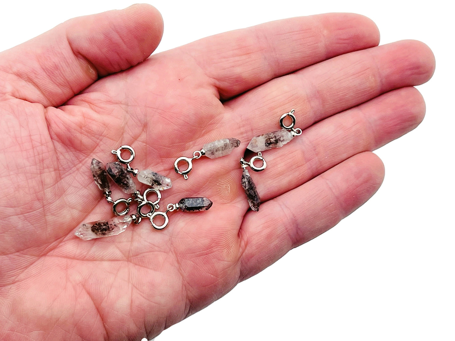 Herkimer Diamond crystal pendant featuring a sparkling gemstone with silver setting, ideal for making jewelry or as a birthstone pendant.