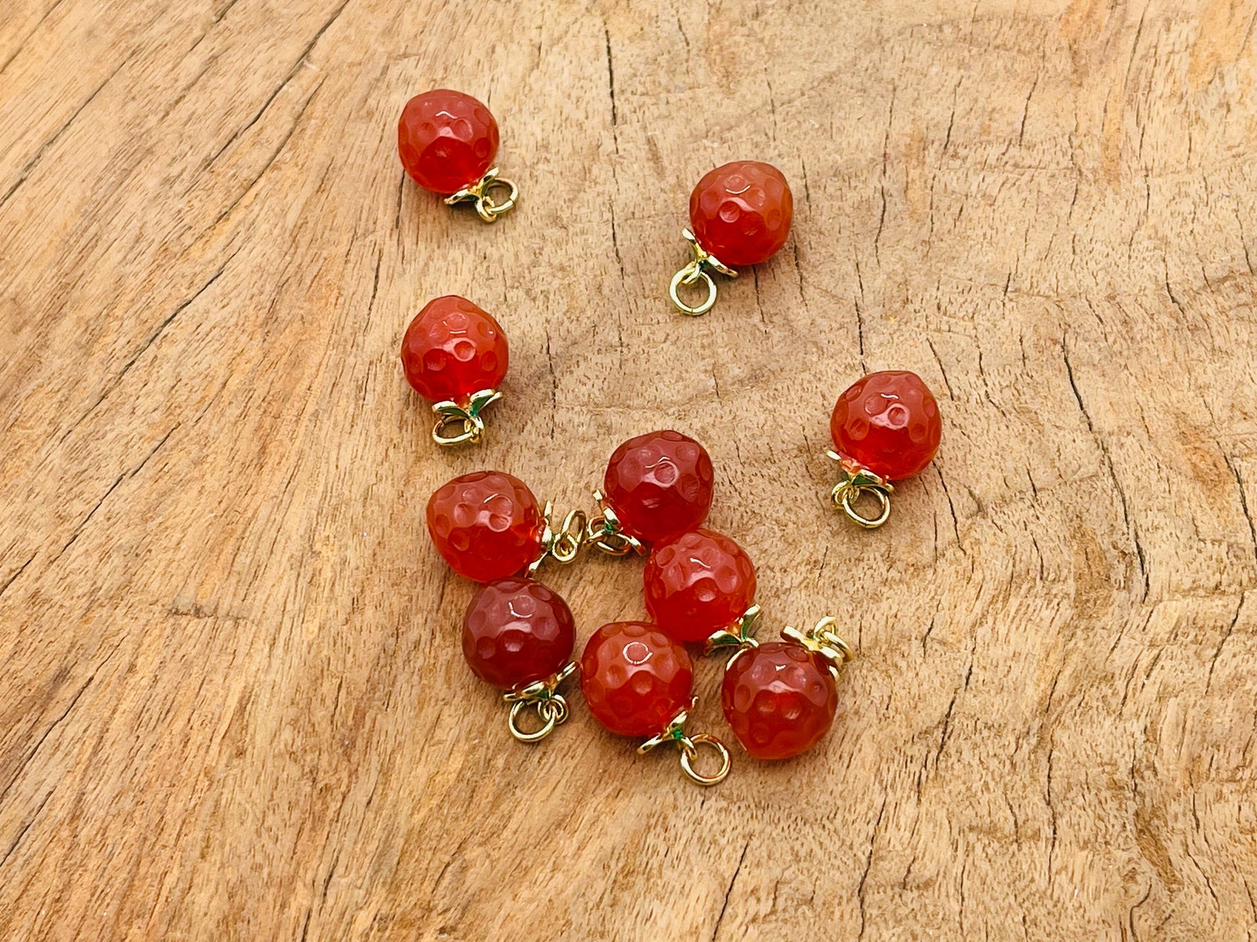 Carnelian crystal pendant from GemstoneGO, showcasing a vibrant orange gemstone with silver setting, ideal for jewelry making.