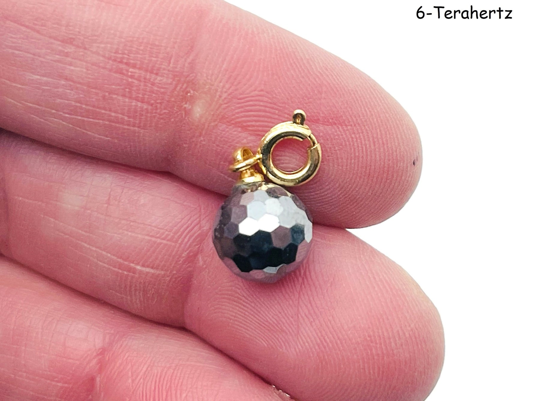 GemstoneGO terahertz gemstone pendant for jewelry making, showcasing a vibrant, polished gemstone in a natural setting
