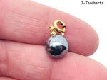 Terahertz gemstone pendant from GemstoneGO, showcasing a vibrant, polished gemstone in a jewelry-making design.